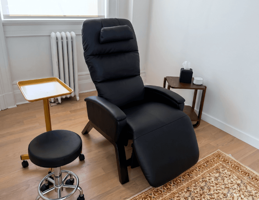 A comfortable reclining chair set up for a calm treatment session