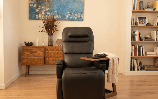 Private treatment room with a black zero-gravity reclining chair